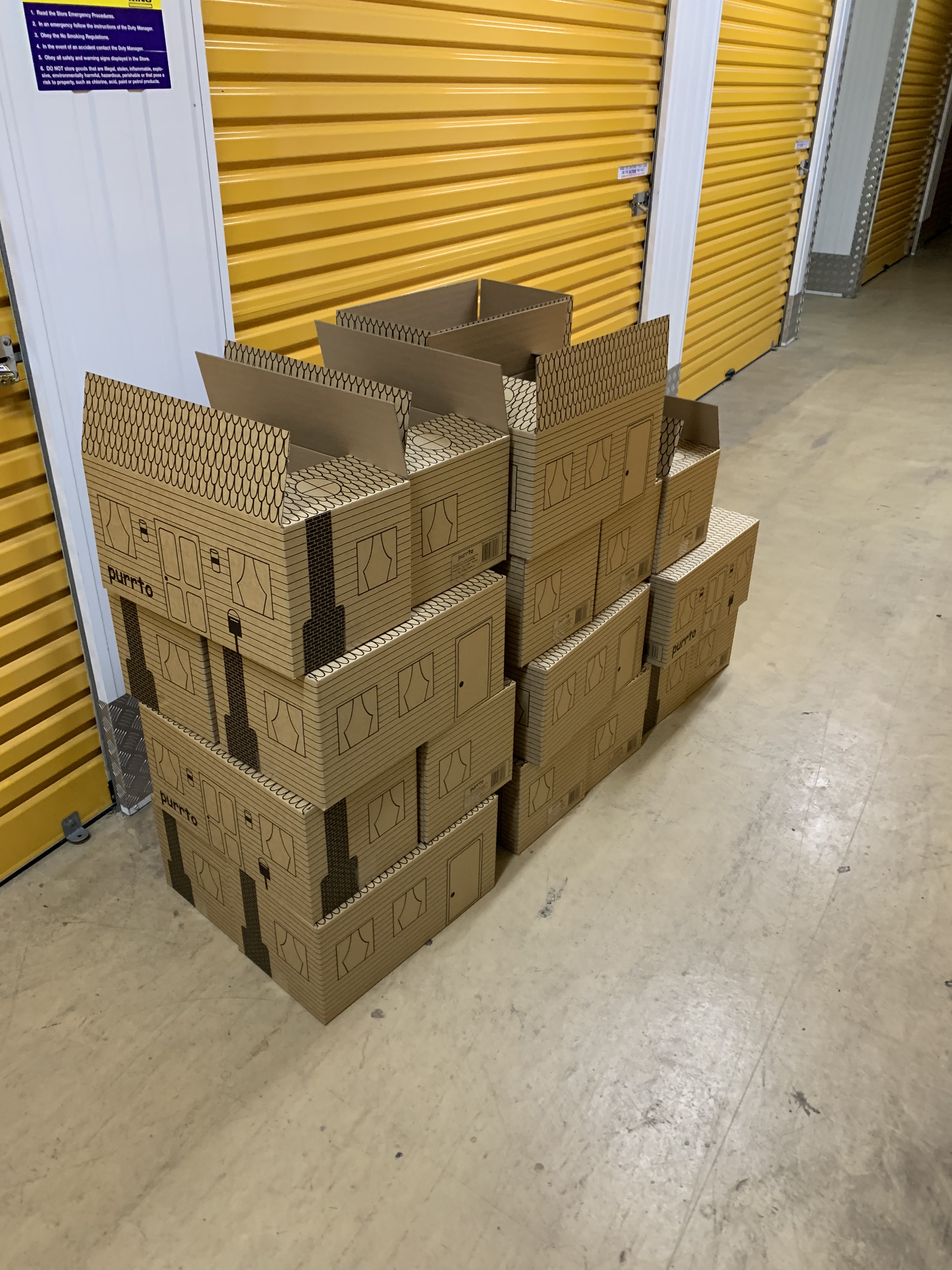 Flat-packed purrto cardboard sheets on pallets